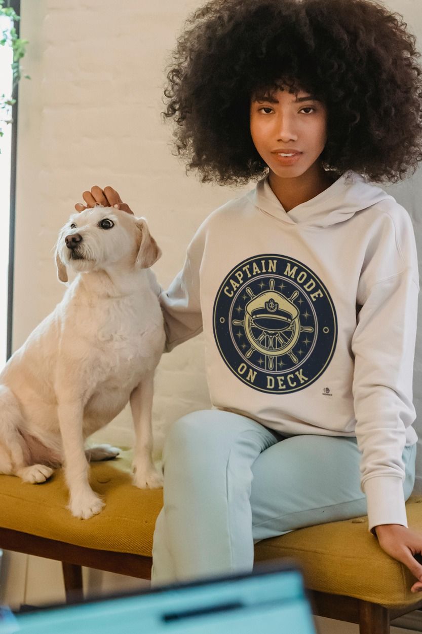Woman with her dog wearing a VIZVOICE hoodie